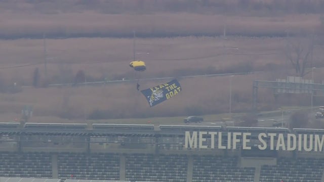 US Navy elite paratroopers parachute into MetLife Stadium ahead of Army- Navy game