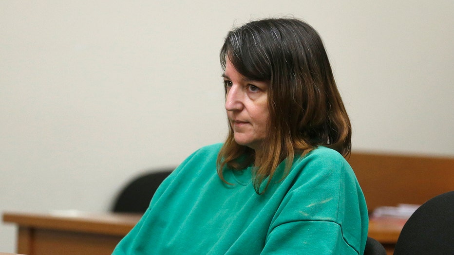FILE- In this June 2, 2015 file photo, Michelle Lodzinski appears in court for a status conference in New Brunswick, N.J. New Jersey's Supreme Court said Friday, Feb. 21, 2020 that it would hear Lodzinski's appeal for the 1991 murder of her five-year-old son, Timothy Wiltsey. Lodzinski was living in Florida when she was arrested in 2014 and charged with the boy's murder. (Patti Sapone/The Star-Ledger via AP, Pool, File)