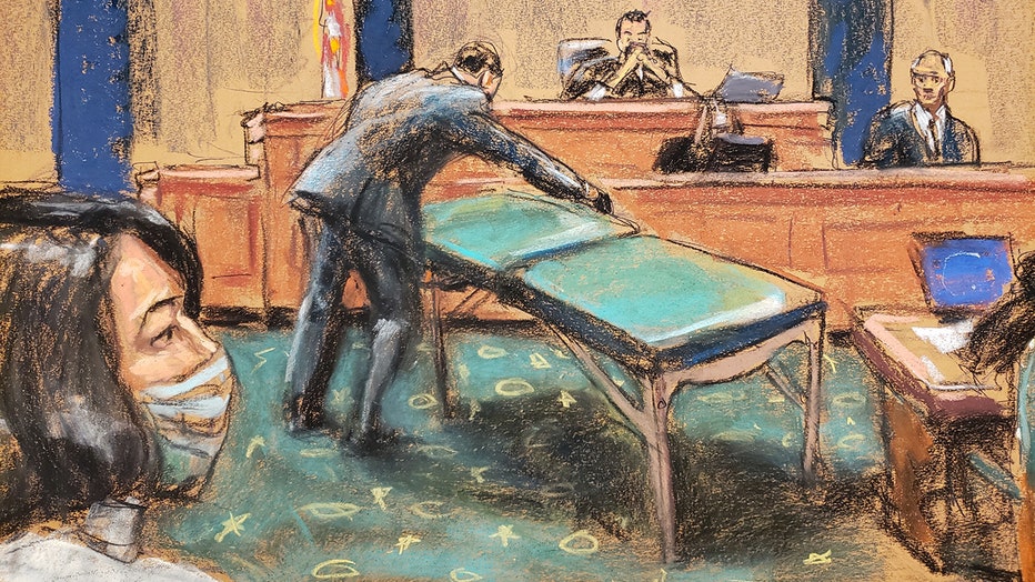 Court sketch shows Ghislaine Maxwell watching prosecutor unfolding a massage table 