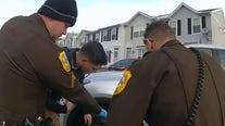 Delaware cops lift SUV, rescue elderly woman pinned underneath