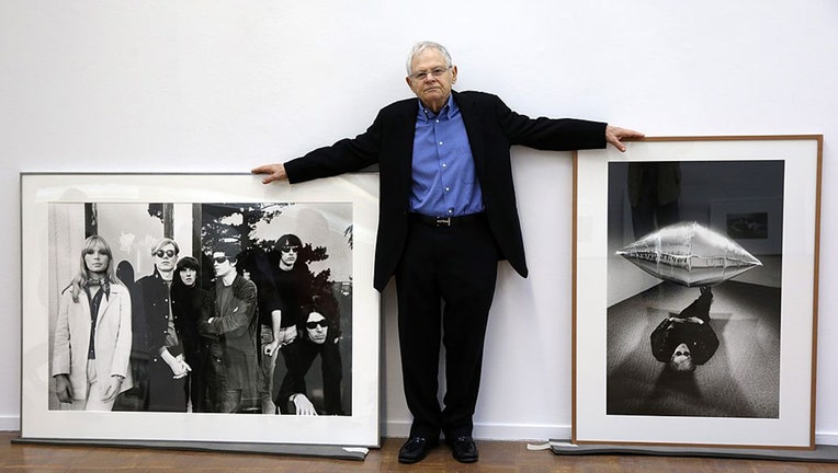 US photographer Steve Schapiro poses next to some of his works during a press conference on March 22, 2013 at the Kunsthalle museum in Rostock, northeastern Germany.