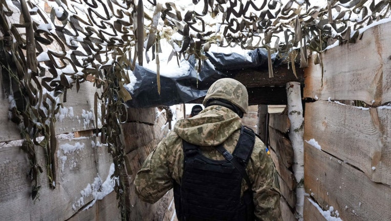 Ukrainian soldiers along the frontline near the town of Zolote-4