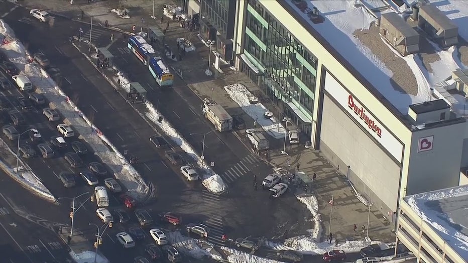 Emergency vehicles are seen outside of Kings Plaza Shopping Center on Monday, Jan. 31, 2022.