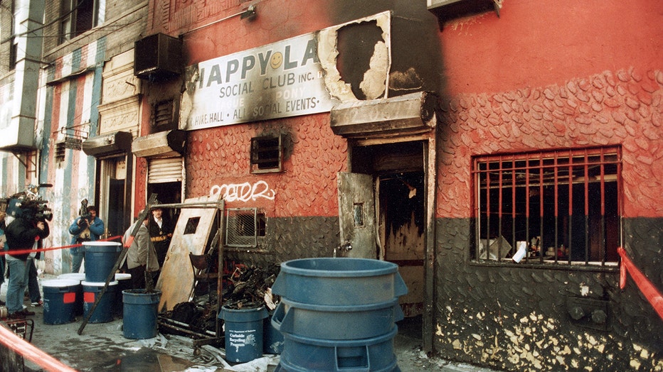 Exterior view of a burned-out building that housed a social club