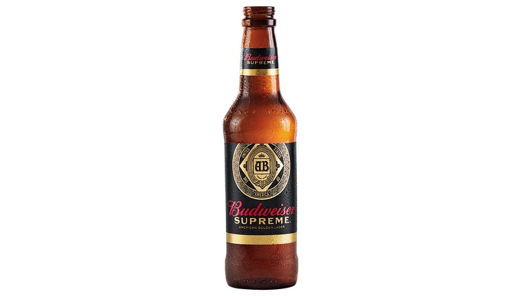 A 12-oz bottle of beer; the glass is amber, the label is black and gold and reads "Budweiser" in red and "Supreme" in gold