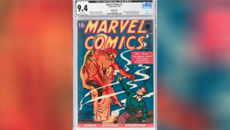 Marvel Comics No. 1 shows a man shooting at a flaming person