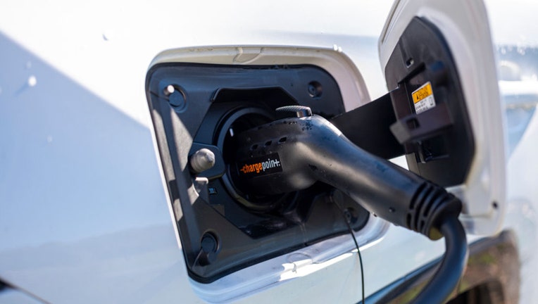 An electric car recharges its batteries. (Photo by Robert Nickelsberg/Getty Images)