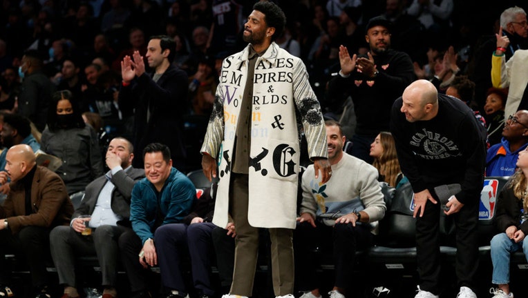 Kyrie Irving of the Brooklyn Nets attends the second half against the New York Knicks at Barclays Center on March 13, 2022 in the Brooklyn borough of New York City. The Nets won 110-107. NOTE TO USER: User expressly acknowledges and agrees that, by downloading and or using this photograph, User is consenting to the terms and conditions of the Getty Images License Agreement. (Photo by Sarah Stier/Getty Images)