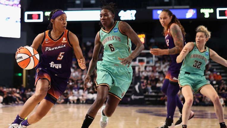 PHOENIX, ARIZONA - SEPTEMBER 23: Shey Peddy #5 of the Phoenix Mercury controls the ball past Natasha Howard #6 of the New York Liberty during the second half of the first round WNBA playoffs at Grand Canyon University Arena on September 23, 2021 in Phoenix, Arizona. The Mercury defeated the Liberty 83-82.