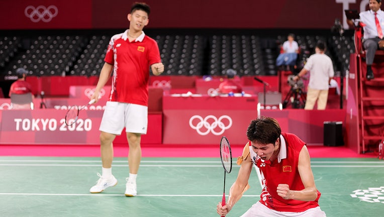 Li Jun Hui(right) and Liu Yu Chen of Team China react as they compete during a match at the Tokyo 2020 Olympic Games on July 27, 2021. (Photo by Lintao Zhang/Getty Images)