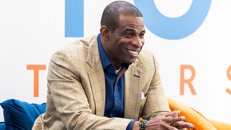 Deion Sanders on stage during the 2022 International Poverty Forum at Porsche Cars North America on March 04, 2022 in Atlanta, Georgia. (Photo by Derek White/Getty Images)