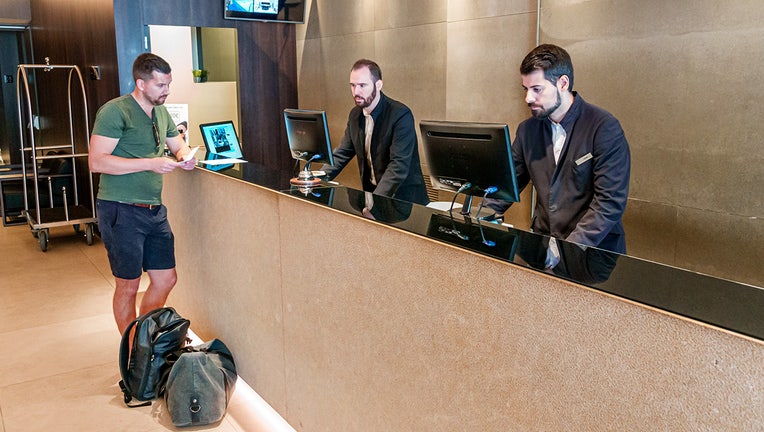 Hotel lobby and guest check in. (Photo by: Jeff Greenberg/Education Images/Universal Images Group via Getty Images)