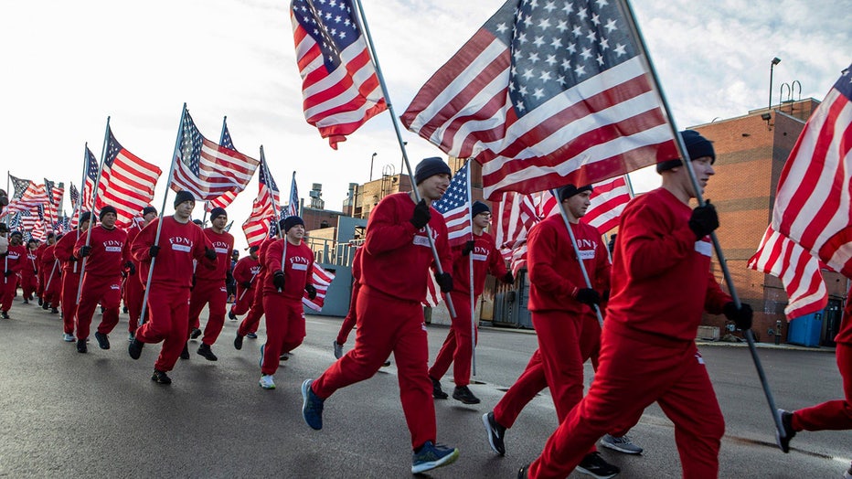 FDNY probationary firefighters carried Ukrainian flags as they jogged across Ward’s Island Bridge. (FDNY via Storyful)
