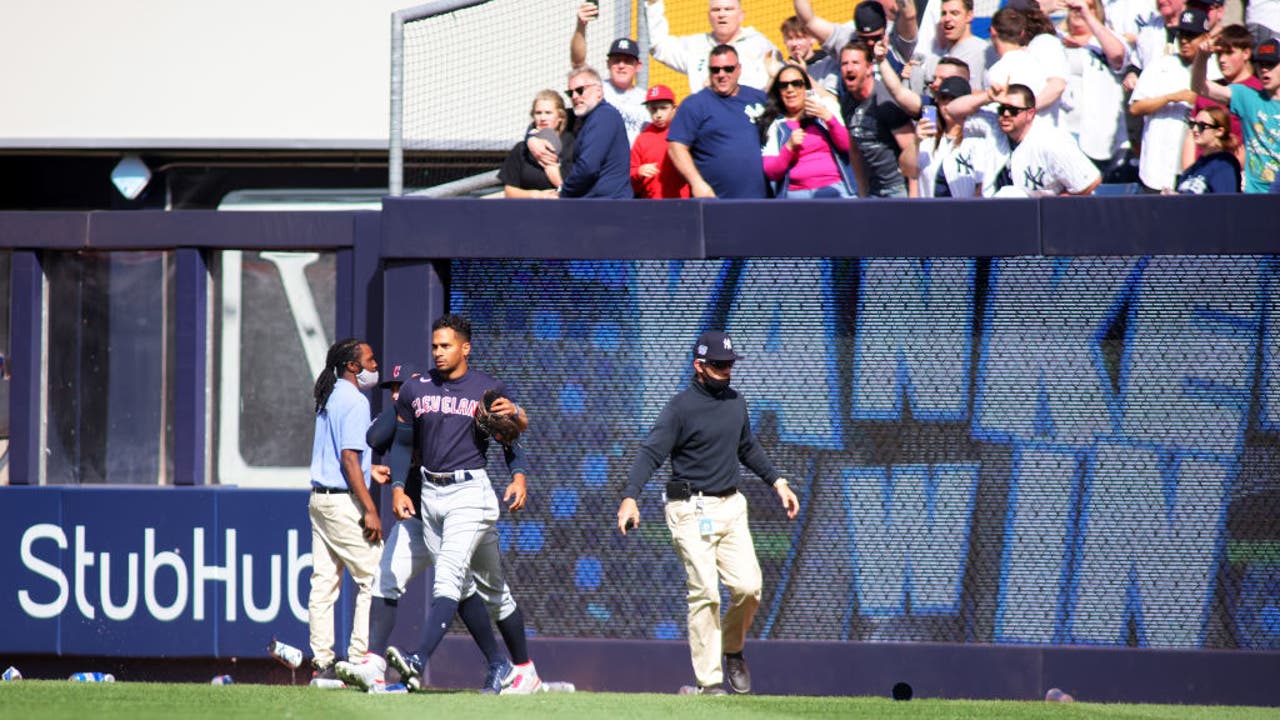 Yankees fans pelt Cleveland outfielders with debris after comeback win