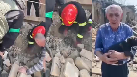 Watch: Ukrainian police rescue elderly man's puppy from rubble