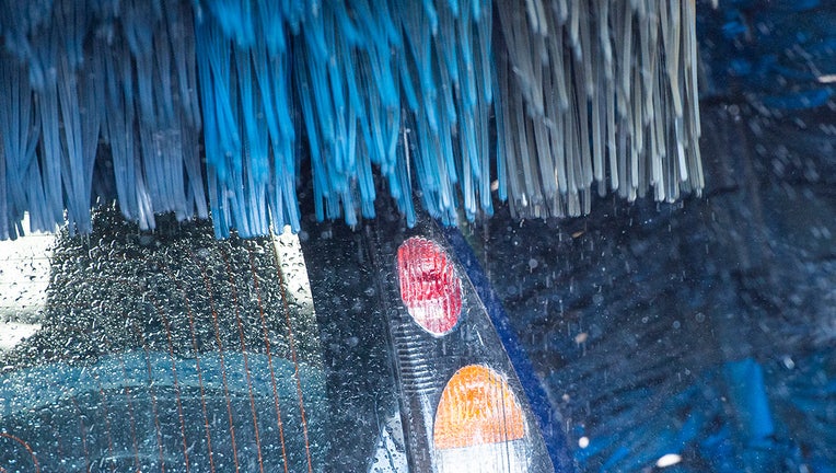 A car is seen in a car wash.(File photo by Christophe Gateau/picture alliance via Getty Images)