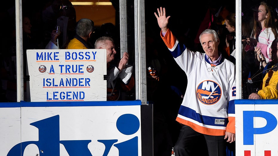 FILE - Hockey Hall of Famer and former New York Islander Mike Bossy waves to fans as he is introduced before the NHL hockey game between the Islanders and the Boston Bruins at Nassau Coliseum on Thursday, Jan. 29, 2015, in Uniondale, N.Y.