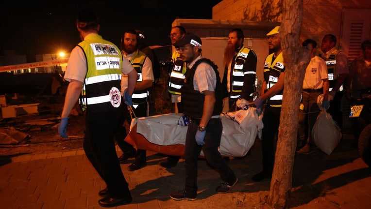 Israeli police and paramedics work at the scene after the attack El'ad, Israel on May 05, 2022. At least 3 people were killed and 4 more wounded. (Photo by Nir Keidar/Anadolu Agency via Getty Images)
