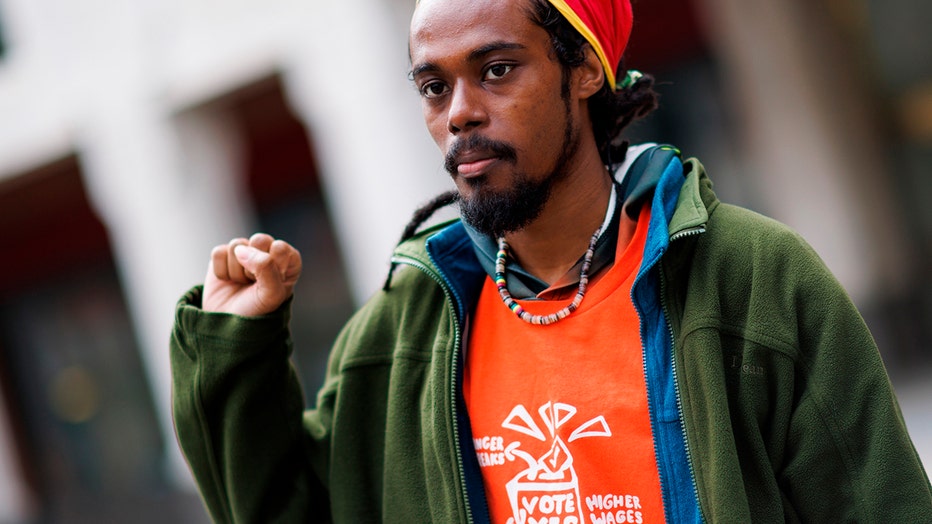 FILE - Amazon Labor Union (ALU) member Tristan Lion Dutchin, 27, gestures as he waits the voting results, Friday, April 1, 2022, in the borough of New York.