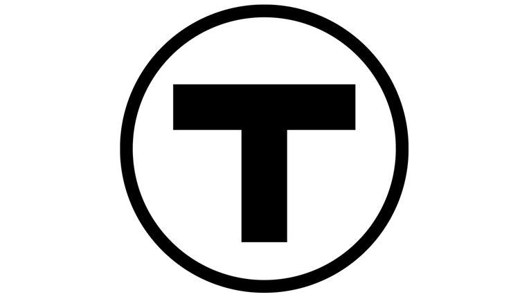 Black T inside a black circle on a white background