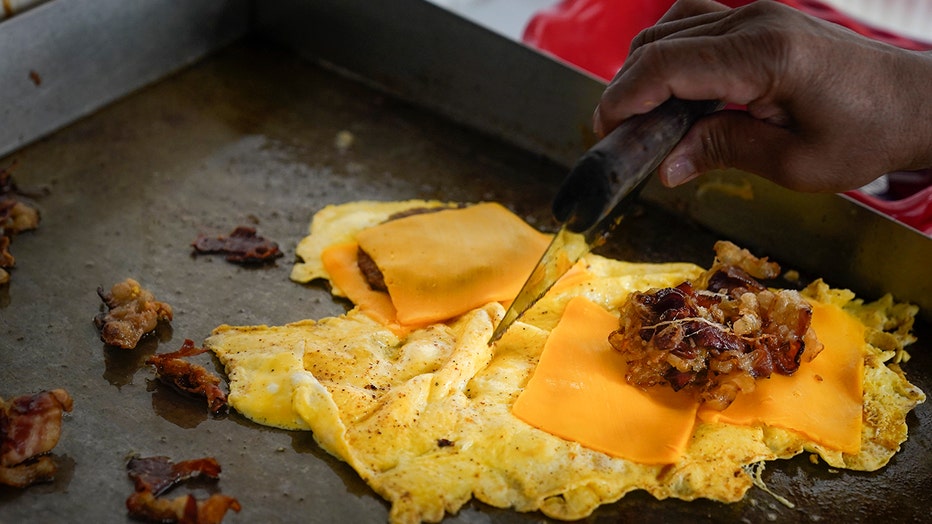 The cost of New York City's favorite breakfast is on the rise. The bacon, egg and cheese sandwich is easy to make, easy to eat on the go and cheap -- although not as cheap as it used to be. (AP Photo/Seth Wenig)
