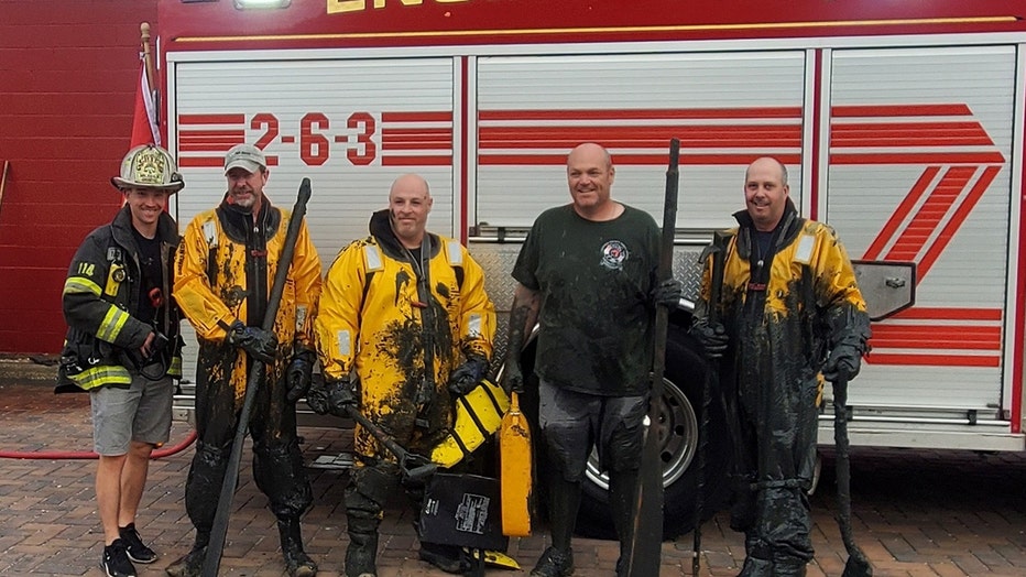 Members of the Centerport Fire Department rescued a man stuck in waist-deep mud. (Credit: Centerport FD)