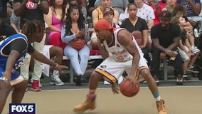 Fans pack Rucker Park for streetball game