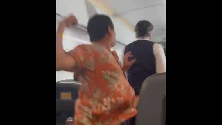 Airplane passenger punches flight attendant from behind in viral video. He’d just been told he couldn’t use first-class lavatory.