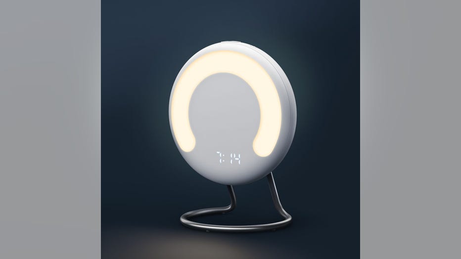 A circular device with a light and a digital clock display