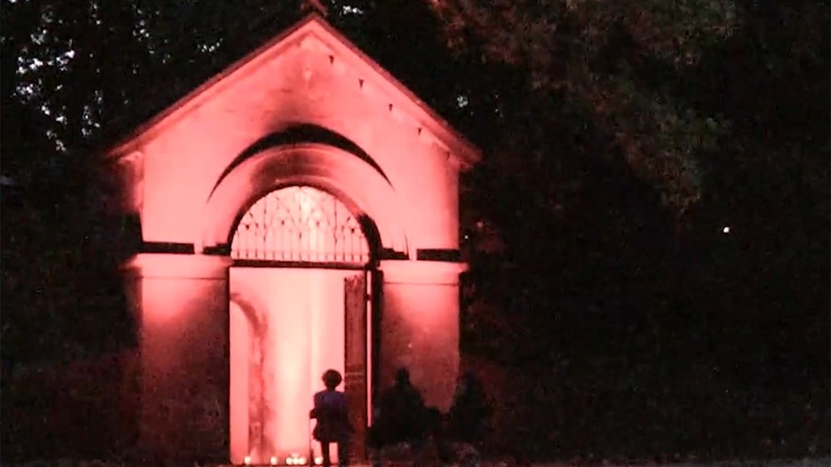 An entrance to the cemetery catacomb illuminated in red