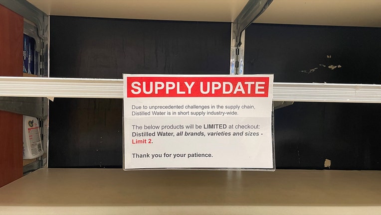 A sign on an empty shelf at a Garwood, N.J. grocery store warns of a national distilled water shortage. (Luke Funk/FOX 5 NY)