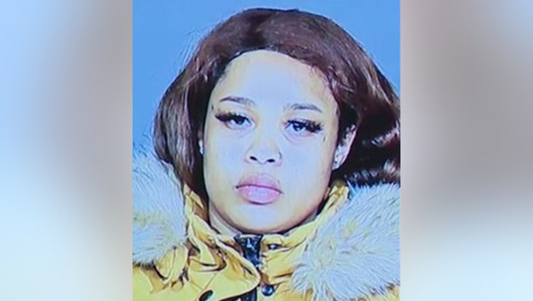 Closeup photo of a woman wanted in connection with a robbery