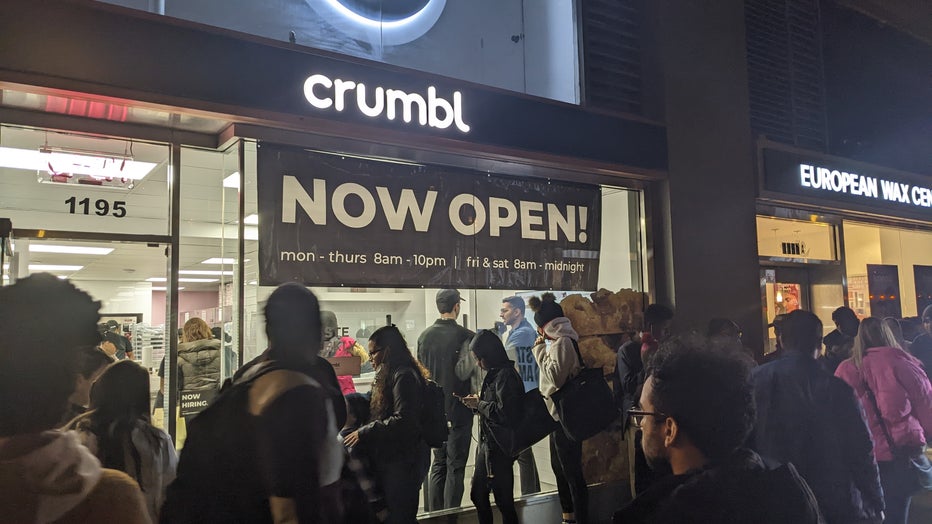 Crowds of people waited outside a Crumbl store in Manhattan.