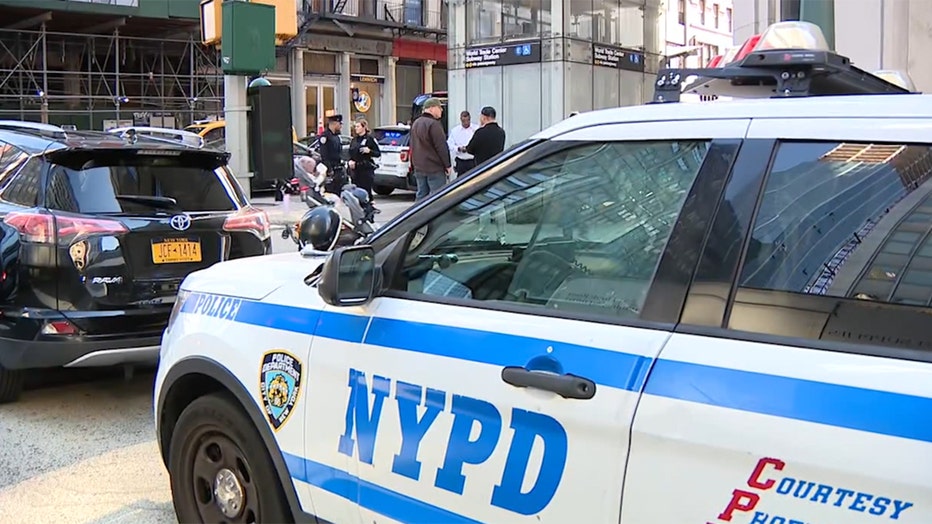 Police vehicle on the street outside a subway entrance