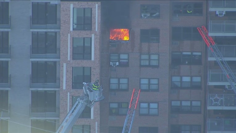 A fire was pouring out of a high-rise building in the Morris Heights section of the Bronx.