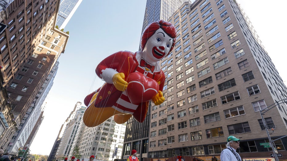 Handlers steer the Ronald McDonald balloon down Sixth Avenue during the Macy's Thanksgiving Day Parade, Thursday, Nov. 24, 2022, in New York. (AP Photo/Jeenah Moon)