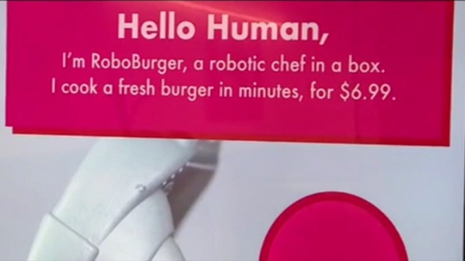 The Robo-Burger cooks up hamburgers at the Newport Mall in Jersey City, N.J.