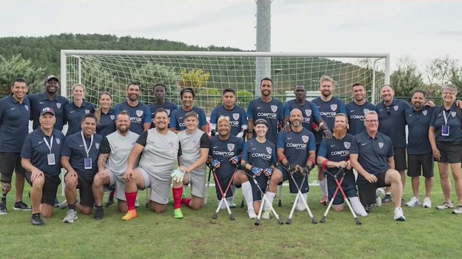 The U.S. National Amputee Soccer Team posing in front of a goal