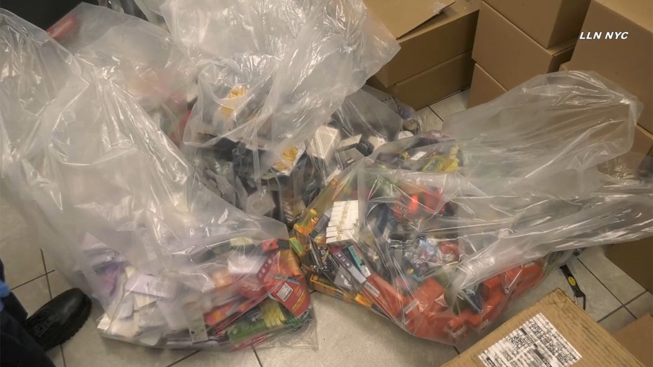 Large clear bags of colorful boxes of smoke products