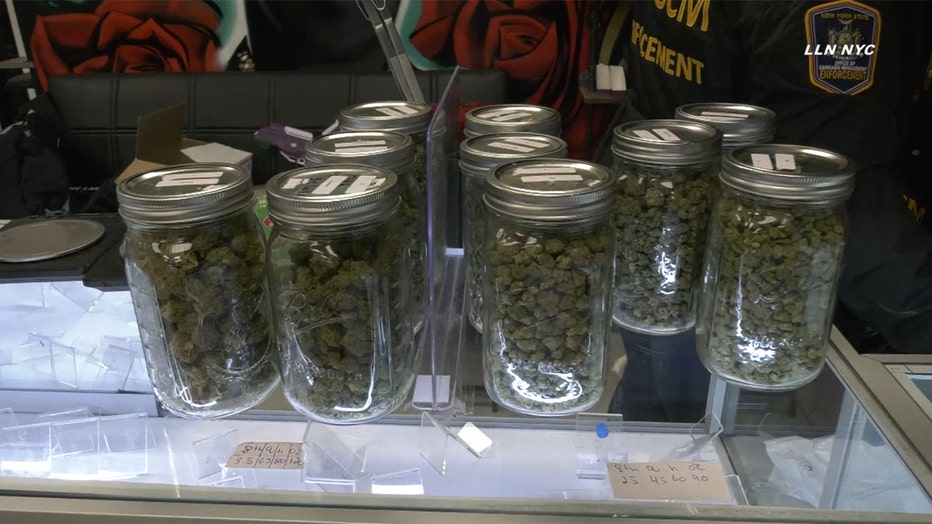 glass jars of dried green buds