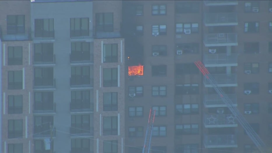 A fire was pouring out of a high-rise building in the Morris Heights section of the Bronx.