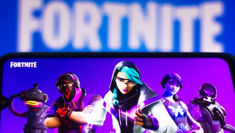 In this photo illustration the Fortnite logo is seen on a