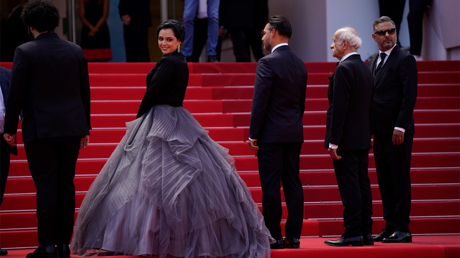FILE - Taraneh Alidoosti, center, poses for photographers upon arrival at the premiere of the film 'Leila's Brothers' at the 75th international film festival, Cannes, southern France, Wednesday, May 25, 2022. Iranian authorities arrested Alidoosti, one of the country’s most famous actresses on charges of spreading falsehoods about nationwide protests that grip the country, state media said Saturday, Dec. 17. (AP Photo/Daniel Cole, File)