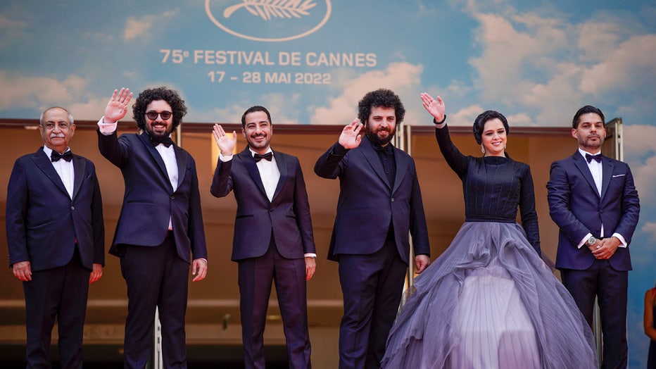 FILE - Bahram Dehghani, from left, Hooman Behmanesh, Navid Mohammadzadeh, director Saeed Roustayi, Taraneh Alidoosti, and Payman Maadi pose for photographers upon arrival at the premiere of the film 'Leila's Brothers' at the 75th international film festival, Cannes, southern France, Wednesday, May 25, 2022. Iranian authorities arrested Alidoosti, one of the country’s most famous actresses on charges of spreading falsehoods about nationwide protests that grip the country, state media said Saturday, Dec. 17. (AP Photo/Daniel Cole, File)
