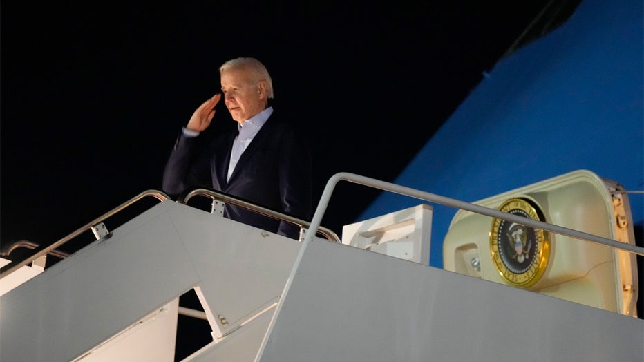 President Joe Biden salutes as he boards Air Force One at Andrews Air Force Base, Md., on Tuesday, Dec. 27, 2022. Biden and his family are traveling to St. Croix, U.S. Virgin Islands, to celebrate New Year. (AP Photo/Manuel Balce Ceneta)
