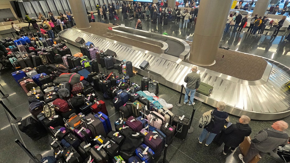 hundreds of pieces of luggage at the Southwest Airlines baggage claim