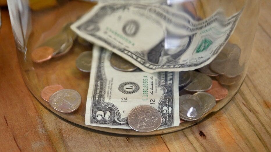 FILE: Money in a tip jar. (Robert Alexander/Getty Images / Getty Images)