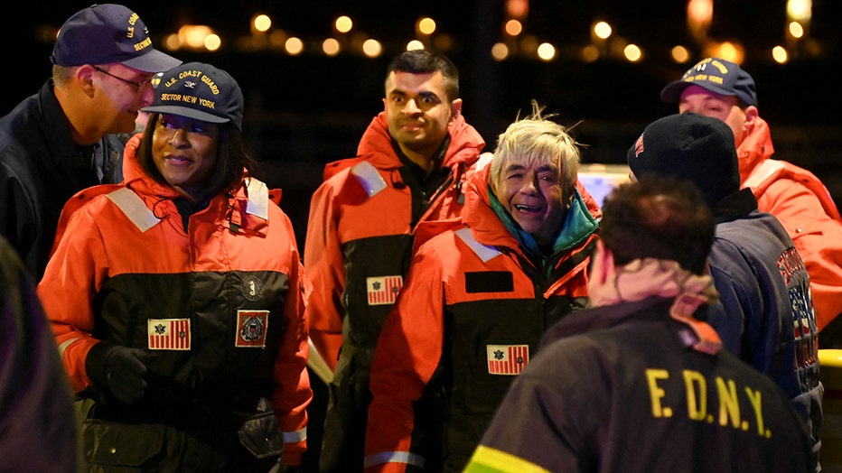 FDNY and USCG members with a rescued sailor