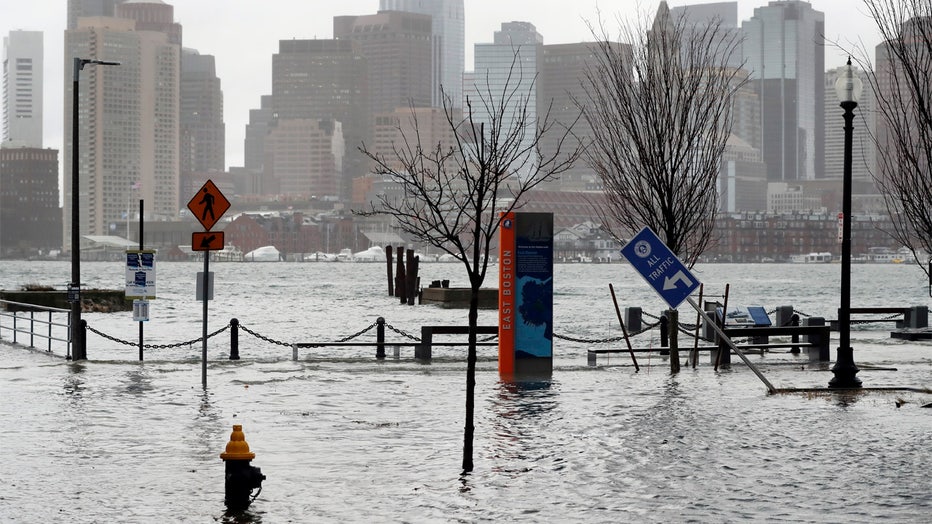 On Friday, December 23, 2022, water floods the streets during high tide in the East Boston neighborhood of Boston. His more than 200 million people (about 60% of the U.S. population), whose winter weather covers the United States, had some form of winter weather advisory or warning on Friday.  (AP Photo/Michael Dwyer)