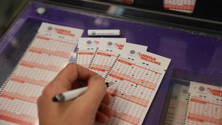 CALIFORNIA, USA - JANUARY 12: A person plays Mega Millions lottery at a store in San Mateo, California, United States on January 12, 2023. Today's Mega Millions jackpot hits $1.35 billion as its 2nd largest in history. (Photo by Tayfun Coskun/Anadolu Agency via Getty Images)
